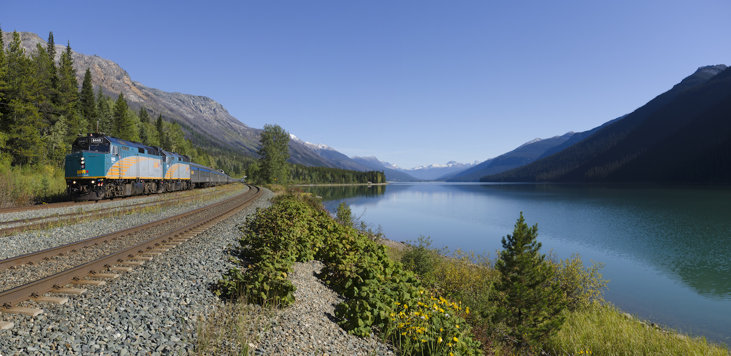 Luxury train traveling through snowy mountains